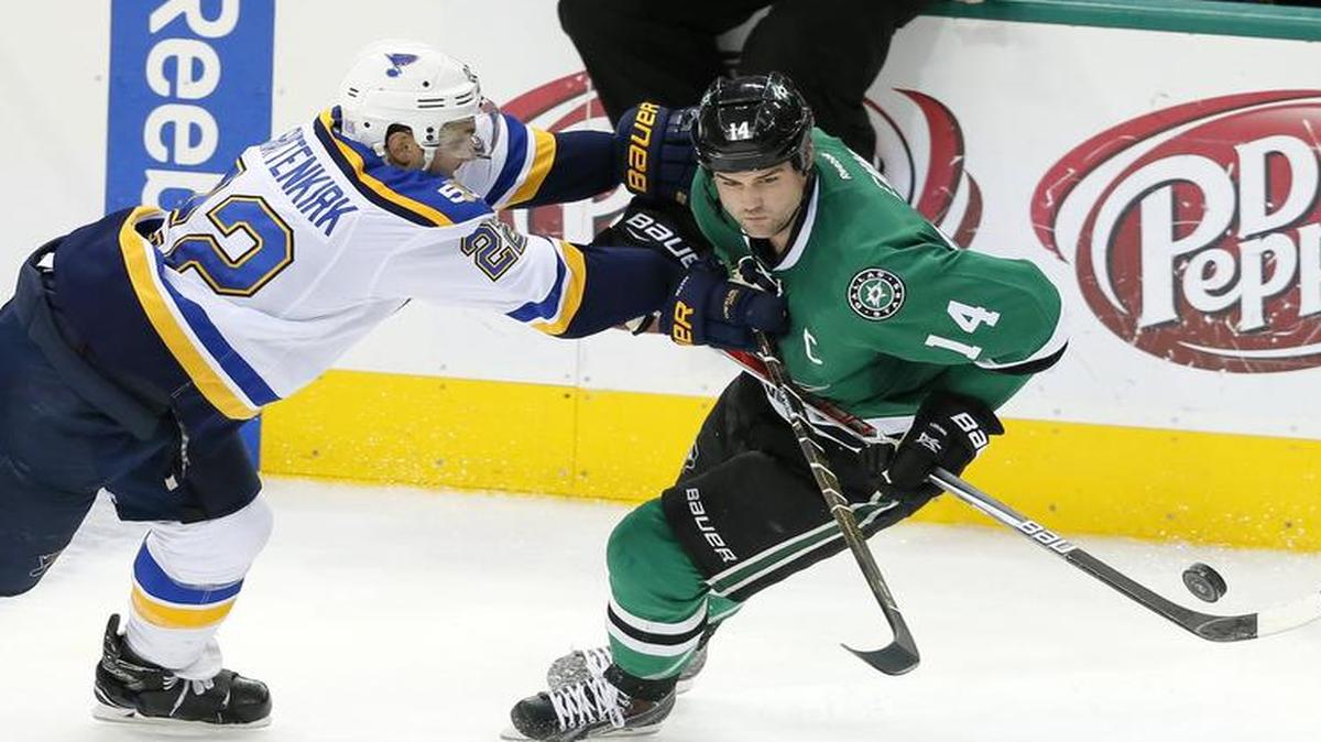 Blues defenseman Kevin Shattenkirk, left, challenges Stars winger Jamie Benn for control of the puck during the third period. The Stars snapped a three-game winless streak with a 6-2 victory.