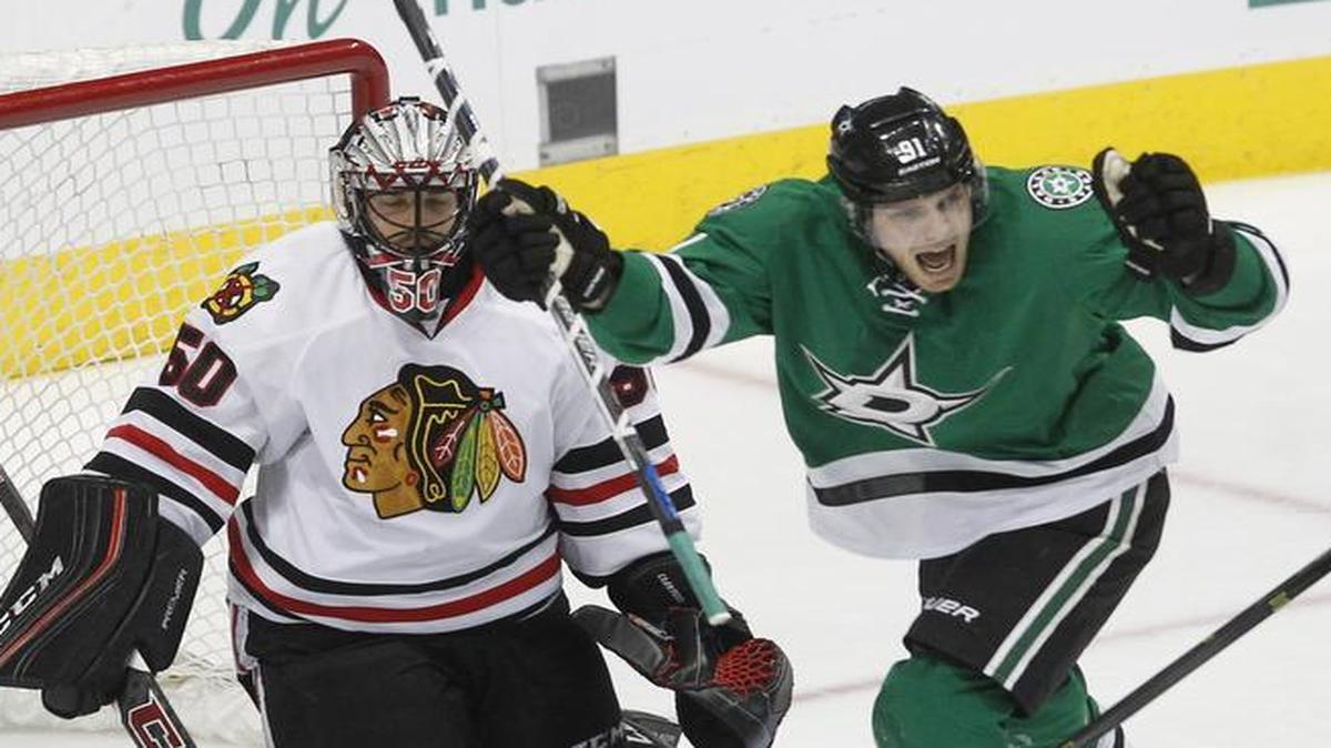 Stars center Tyler Seguin, right, celebrates a goal by teammate Jason Spezza (not shown) against goalie Corey Crawford and the Blackhawks.