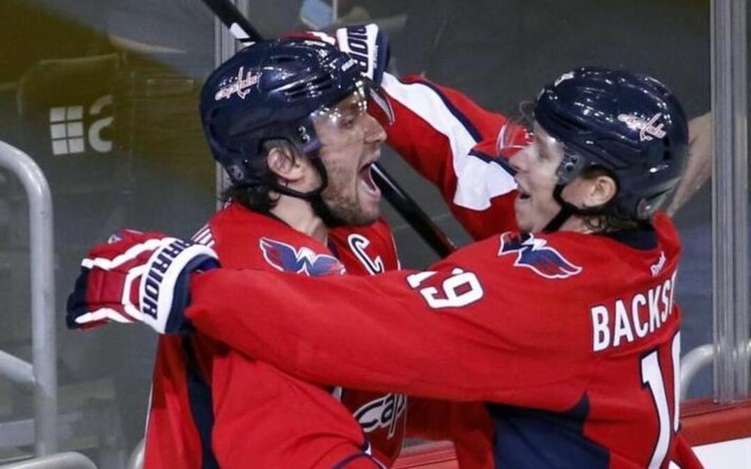 Alex Ovechkin, left, celebrates his 484th career goal with Nicklas Backstrom that made Ovechkin the NHL’s all-time leading Russian-born goal-scorer in a 3-2 loss to Dallas.