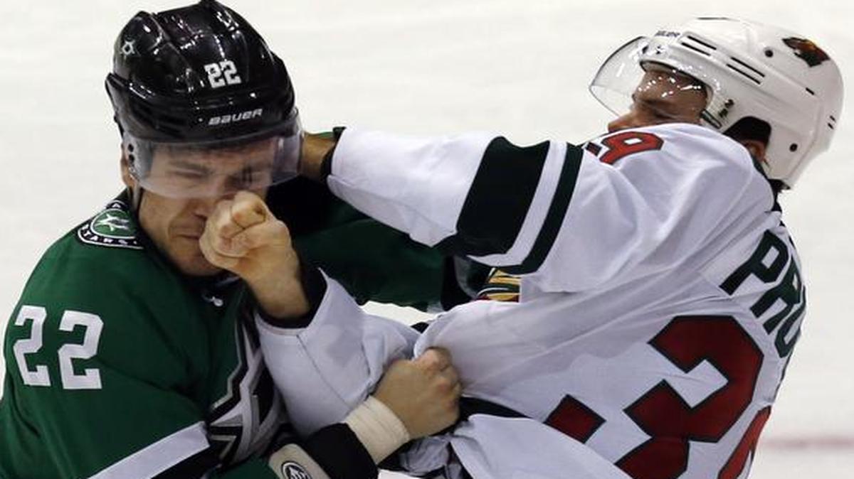 
Dallas Stars center Colton Sceviour (22) and Minnesota Wild defenseman Nate Prosser (39) square off during the second period of an NHL hockey game Saturday, Jan. 3, 2015, in Dallas.
