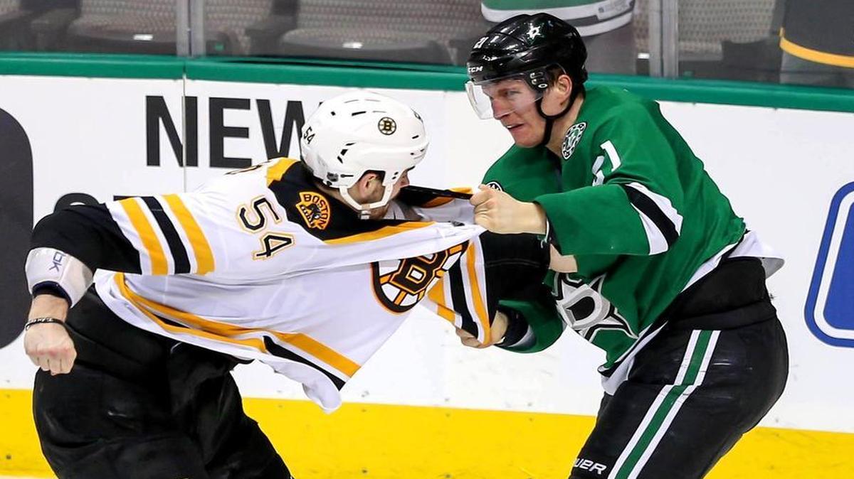 Stars forward Antoine Roussel, right, and Boston’s Adam McQuaid go at it during the second period.