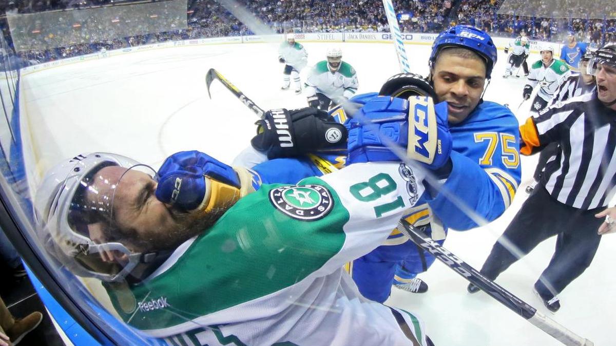Stars forward Patrick Eaves, left, and Blues forward Ryan Reaves exchange shoves during the second period of their NHL game Saturday in St. Louis.