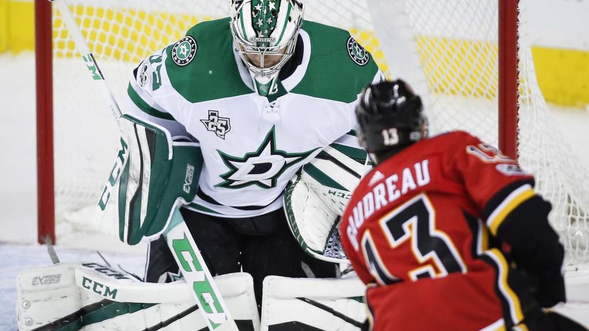 Dallas Stars goalie Kari Lehtonen lets in a goal by Calgary Flames left wing Johnny Gaudreau Friday night.