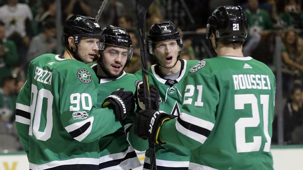 Dallas Stars’ Jason Spezza (90), Remi Elie (40), John Klingberg (3) and Antoine Roussel (21) celebrate a first-period goal by Elie against the Buffalo Sabres Saturday in Dallas.