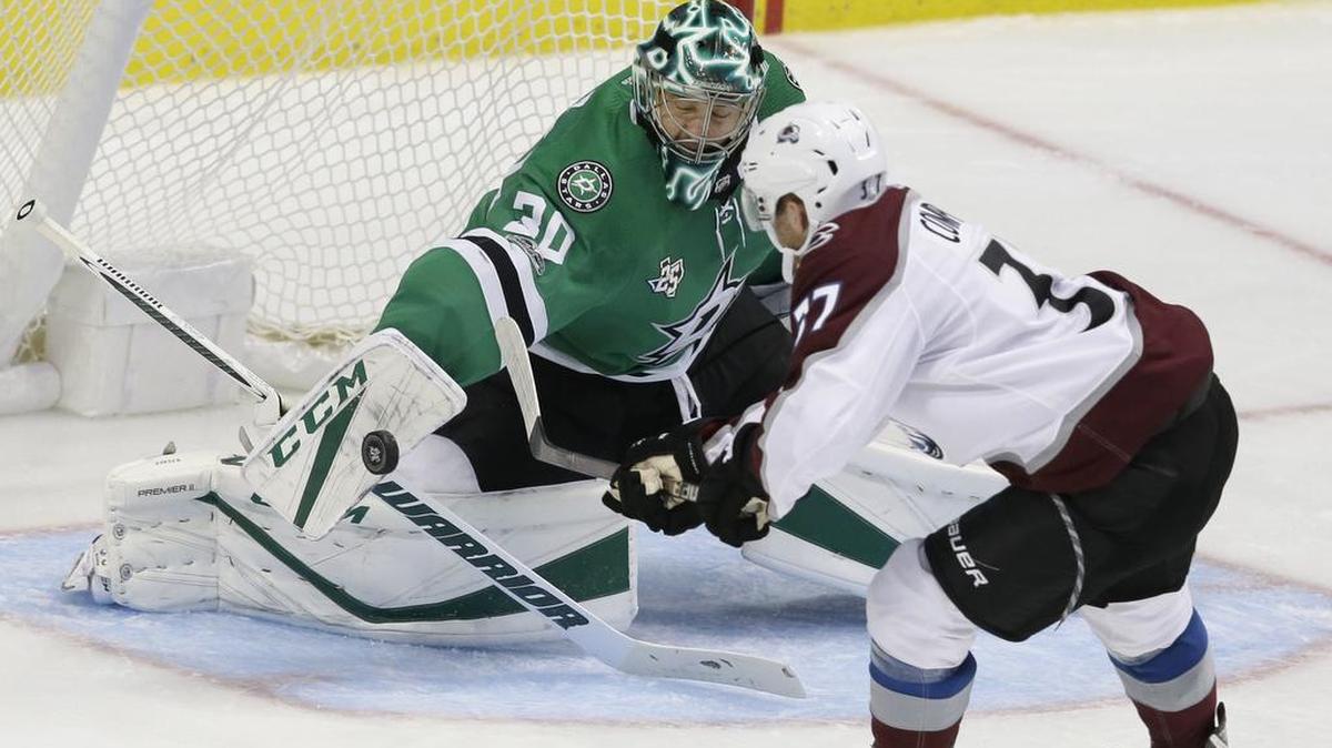 Dallas Stars goalie Ben Bishop (30) blocks a shot against Colorado Avalanche left wing J.T. Compher (37) during the second period Saturday night.