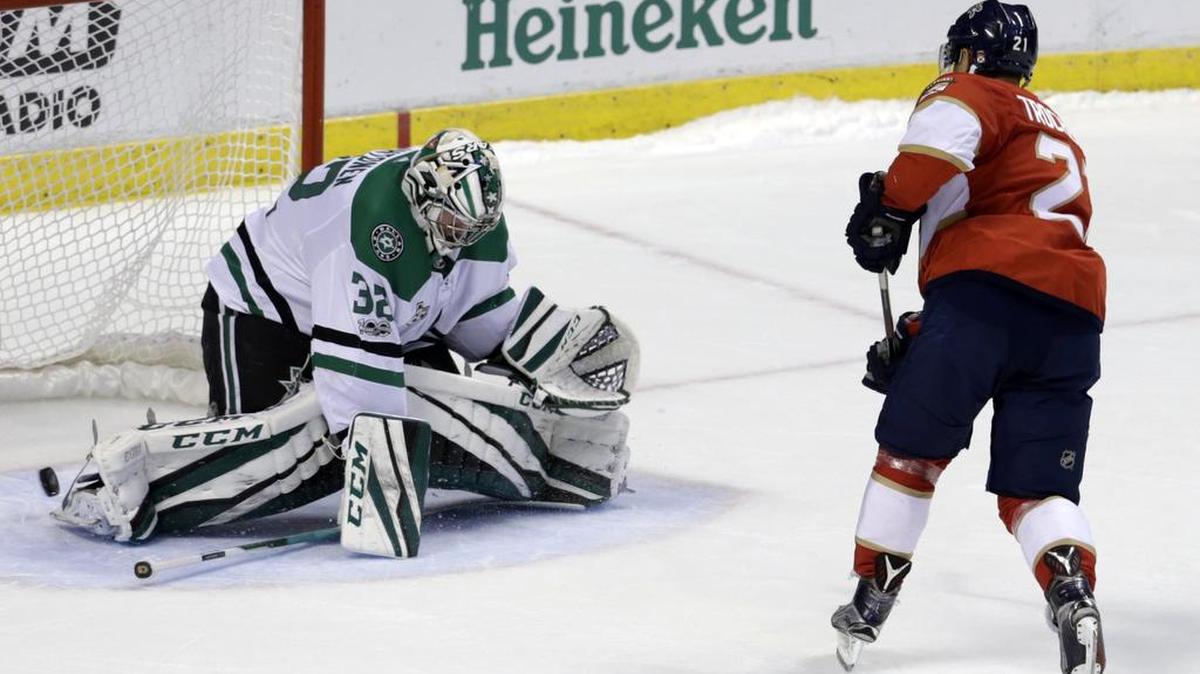 Florida Panthers’ Vincent Trocheck, right, scores the game winner against Dallas Stars goalie Kari Lehtonen during the shootout in Thursday’s game in Sunrise, Fla. The Panthers won 4-3.