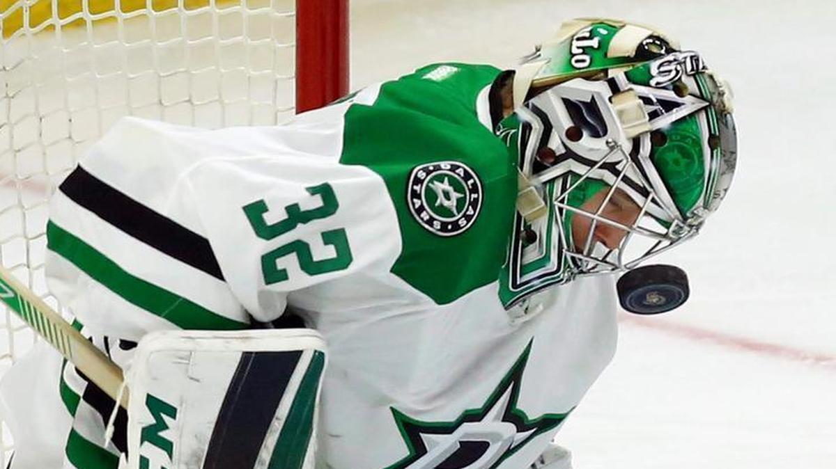 Dallas Stars goalie Kari Lehtonen takes a puck to the cage during the first period against the Ottawa Senators.