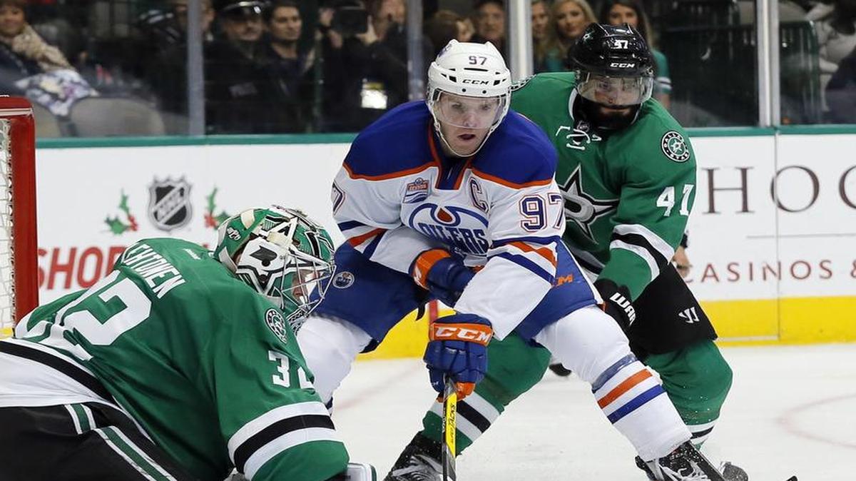 Dallas Stars goalie Kari Lehtonen (32) of Finland blocks a shot from Edmonton Oilers center Connor McDavid (97) as Stars defender Johnny Oduya (47) of Sweden helps defend on the play Saturday, Nov. 19, 2016, in Dallas. Oduya was injured in Saturday’s 5-2 loss to Edmonton and was placed on injured reserve Sunday. McDavid had three goals Saturday.