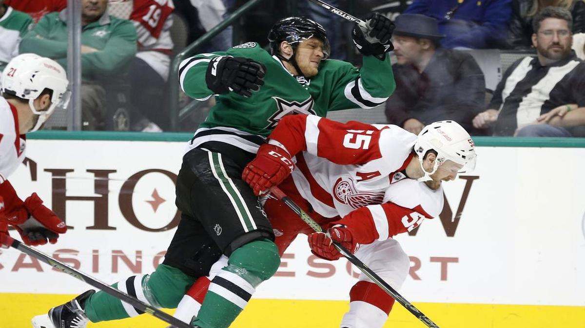 Stars wing Ales Hemsky, left, gets tangled with Red Wings defenseman Niklas Kronwall.