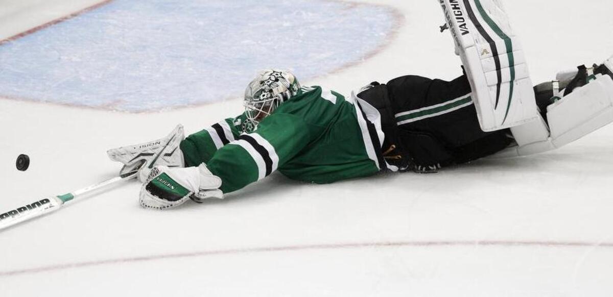 Stars goalie Antti Niemi dives to stop a shot by the Canucks during overtime during the Stars’ 3-2 shootout victory.