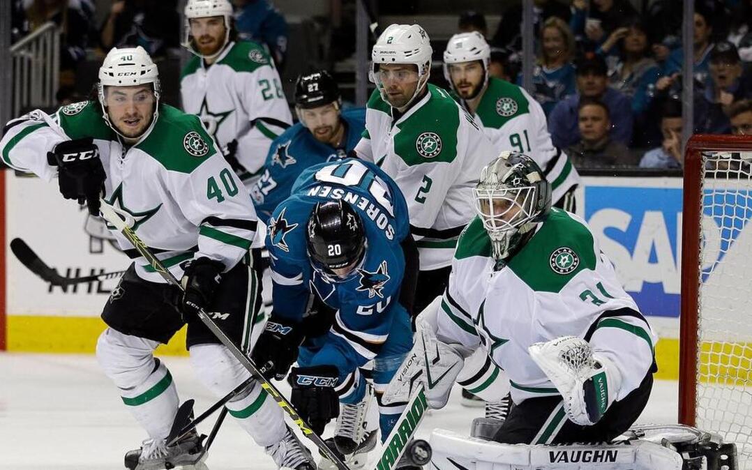 Dallas Stars goalie Antti Niemi, right, blocks a shot from the San Jose Sharks during the third period of an NHL hockey game Sunday, March 12, 2017, in San Jose, Calif. The Sharks won 5-1.