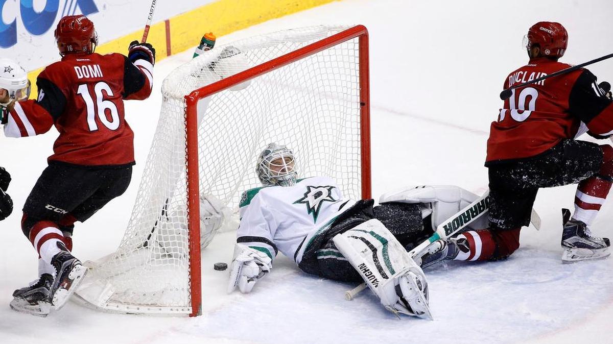 Stars goalie Antti Niemi stays on the ice after giving up a goal to Coyotes’ Max Domi (16) in the second period as Anthony Duclair (10) looks on.