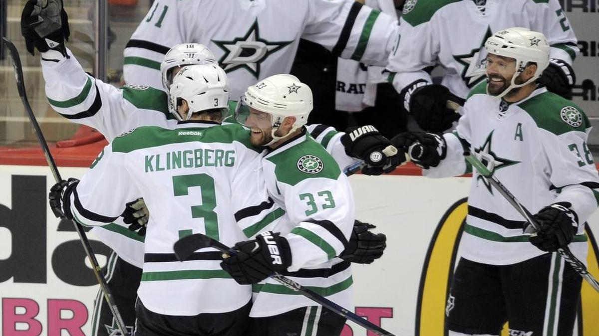 The Stars’ bench spills over onto the ice Tuesday night to congratulate John Klingberg on his winning goal in overtime.