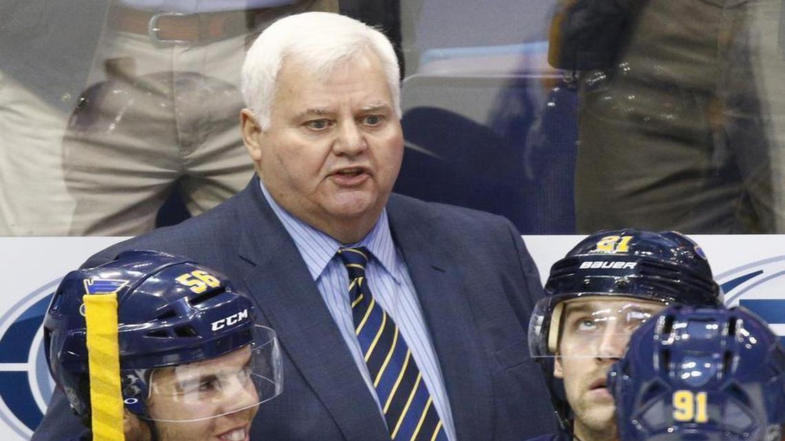 St. Louis Blues head coach Ken Hitchcock speaks to his players from the bench during a NHL hockey game against the Arizona Coyotes, Monday, April 4, 2016, in St. Louis. The Blues won the game 5-2.