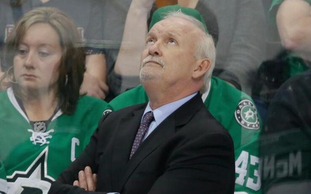 Dallas Stars head coach Lindy Ruff looks up at the scoreboard behind center Gemel Smith (46) and center Mark McNeill (38) during the first period of against the Colorado Avalanche game in Dallas in the season finale Saturday. Ruff was fired as coach on Sunday.
