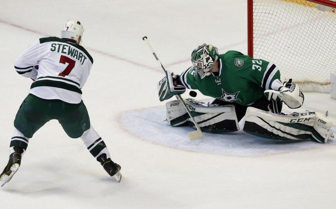 Minnesota Wild right wing Chris Stewart, left, scores the game-winning goal against Stars’ goalie Kari Lehtonen in a shootout Tuesday night in Dallas.