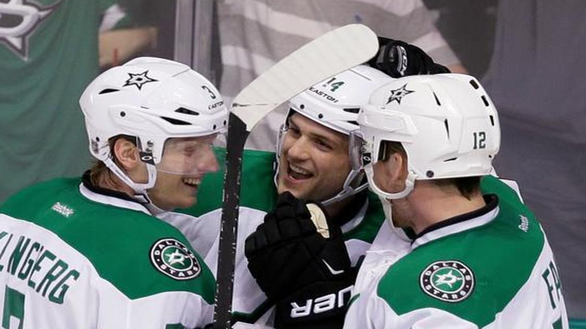 Dallas Stars left wing Jamie Benn, center, celebrates scoring a goal with teammates John Klingberg (3) and Radek Faksa during the second period against the Arizona Coyotes on Thursday.