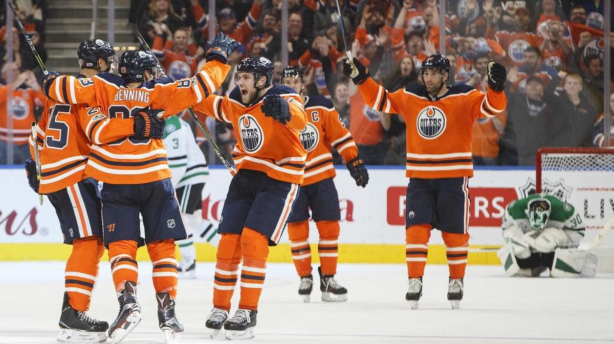 Edmonton Oilers players celebrate Matt Benning’s tiebreaking goal late in the third period against the Dallas Stars on Thursday in Edmonton, Alberta.