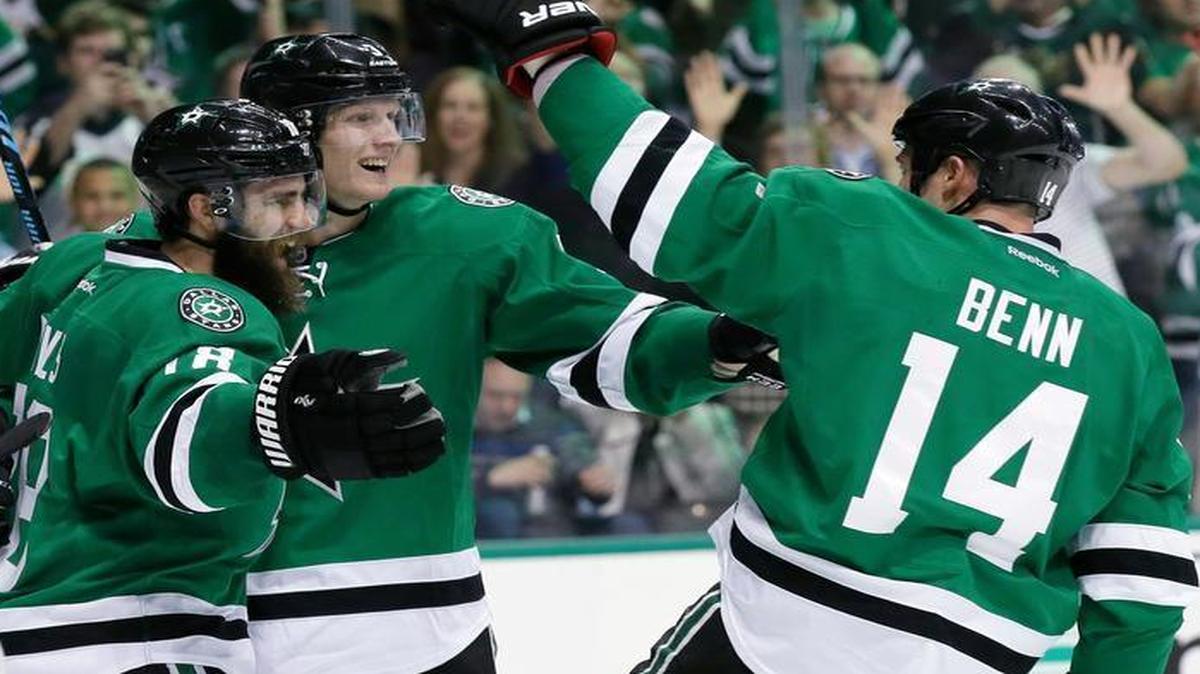 Dallas Stars right wing Patrick Eaves, back left, celebrates his goal with teammates John Klingberg and Jamie Benn (14) during the third period of Game 1 in a first-round Stanley Cup playoff series against the Minnesota Wild.