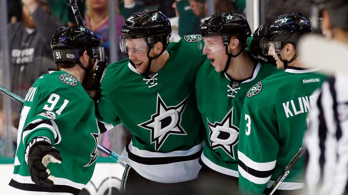 From left, Dallas Stars players Tyler Seguin (91), Radek Faksa (12), Cody Eakin (20) and John Klingberg (3) celebrate after scoring against the Carolina Hurricanes during the first period of an NHL hockey game, Saturday, Feb. 11, 2017, in Dallas.