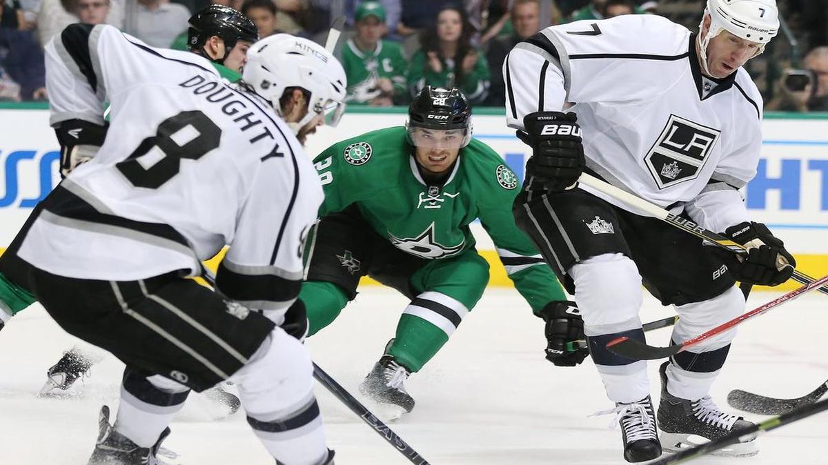 Los Angeles Kings defensemen Drew Doughty, left, and Rob Scuderi look to keep the Dallas Stars and Stephen Johns off balance when they meet Saturday afternoon in Los Angeles. Both teams have clinched playoff berths.