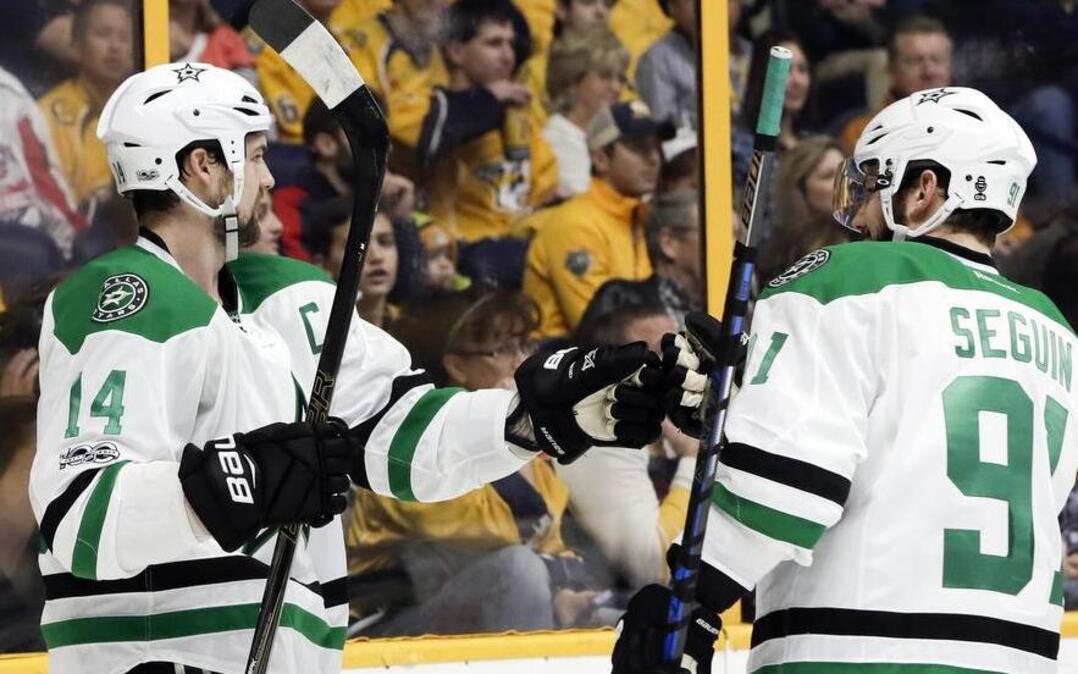 Dallas Stars wing Jamie Benn, left, is congratulated by teammate Tyler Seguin after scoring a goal against the Nashville Predators during the first period Sunday. Benn is questioning the Stars’ mindset after losing 5-3 Sunday to Nashville and fading badly in the final 20 minutes.
