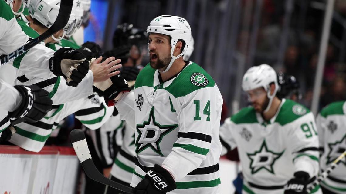 Dallas Stars left wing Jamie Benn (14) is congratulated as he passes the team box after scoring a goal early against the Colorado Avalanche.