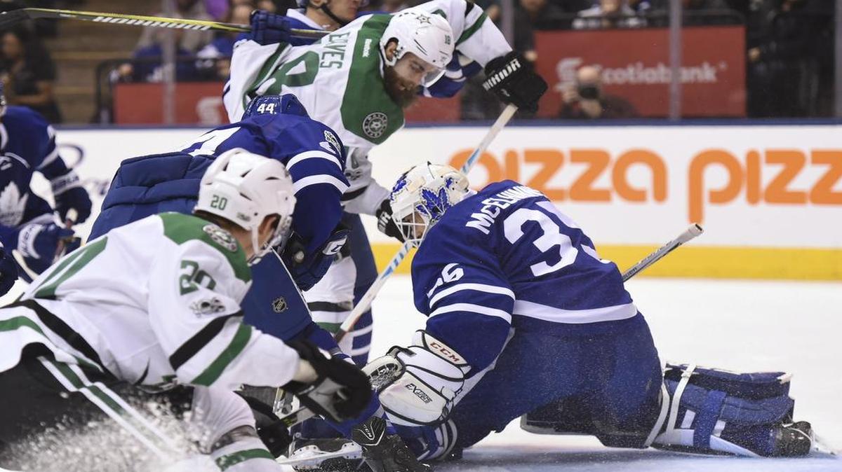 Toronto Maple Leafs goalie Curtis McElhinney makes one of his 39 saves Tuesday night against Stars wing Patrick Eaves in the first period.