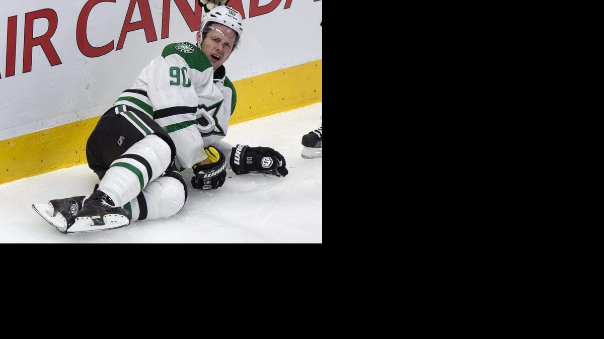 
Stars forward Jason Spezza lies on the ice after a hit by Alexei Emelin, who was ejected on the play.
