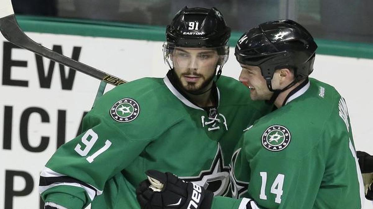 Stars center Tyler Seguin (91) celebrates scoring a goal with teammate Jamie Benn (14) in the second period.