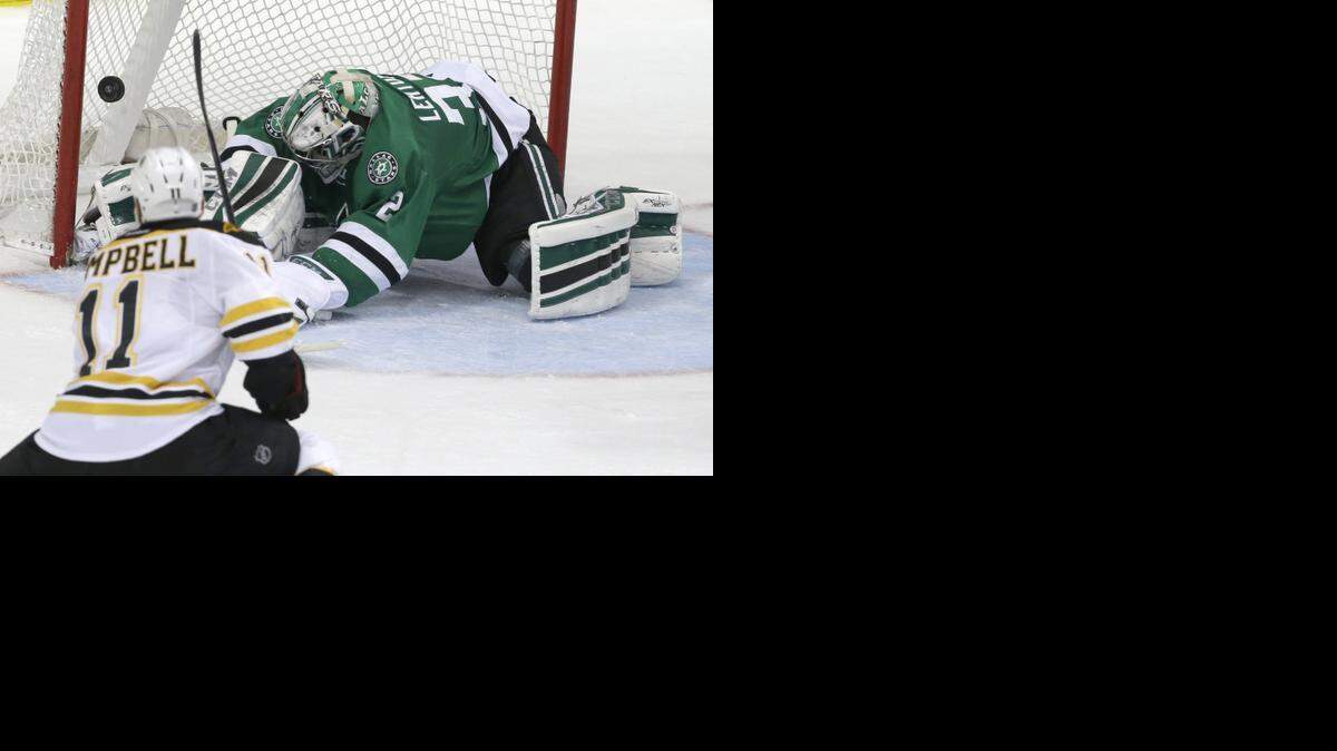 
Bruins center Gregory Campbell scores the go-ahead goal against Stars goalie Kari Lehtonen in the second period.


