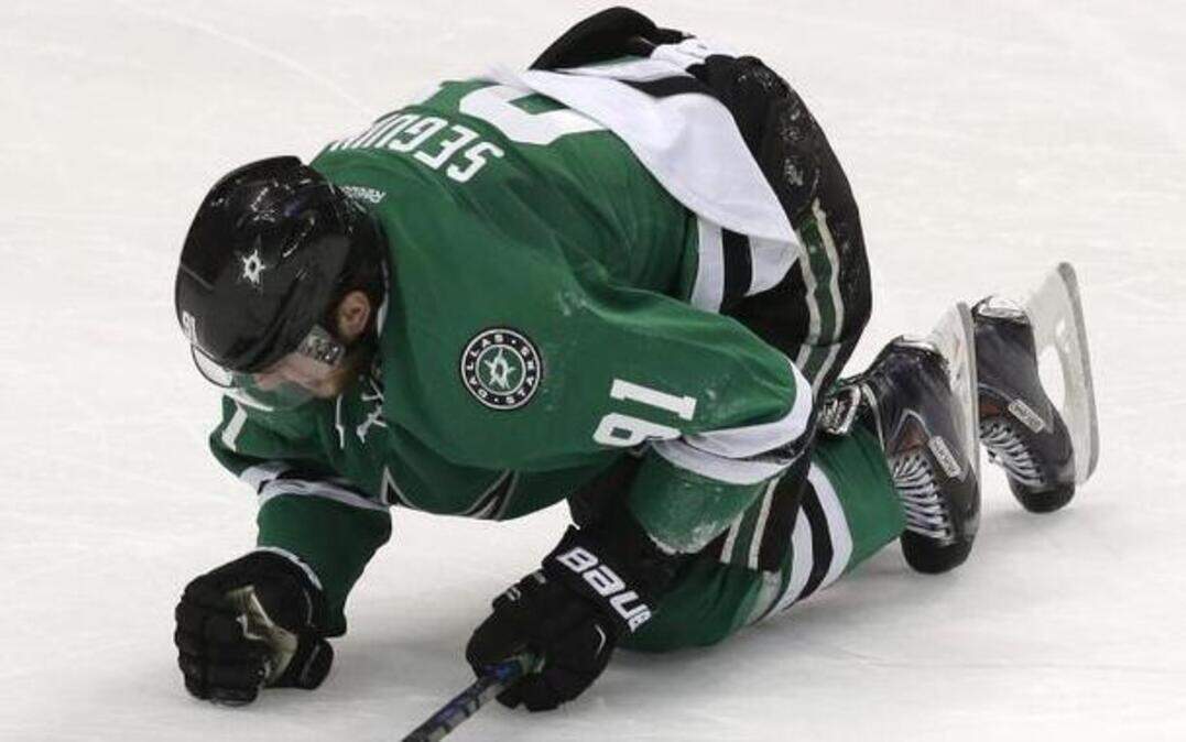 
Dallas Stars center Tyler Seguin (91) kneels on the ice after he was clipped during the third period against the Florida Panthers on Friday in Dallas. The Stars won 2-0. 
