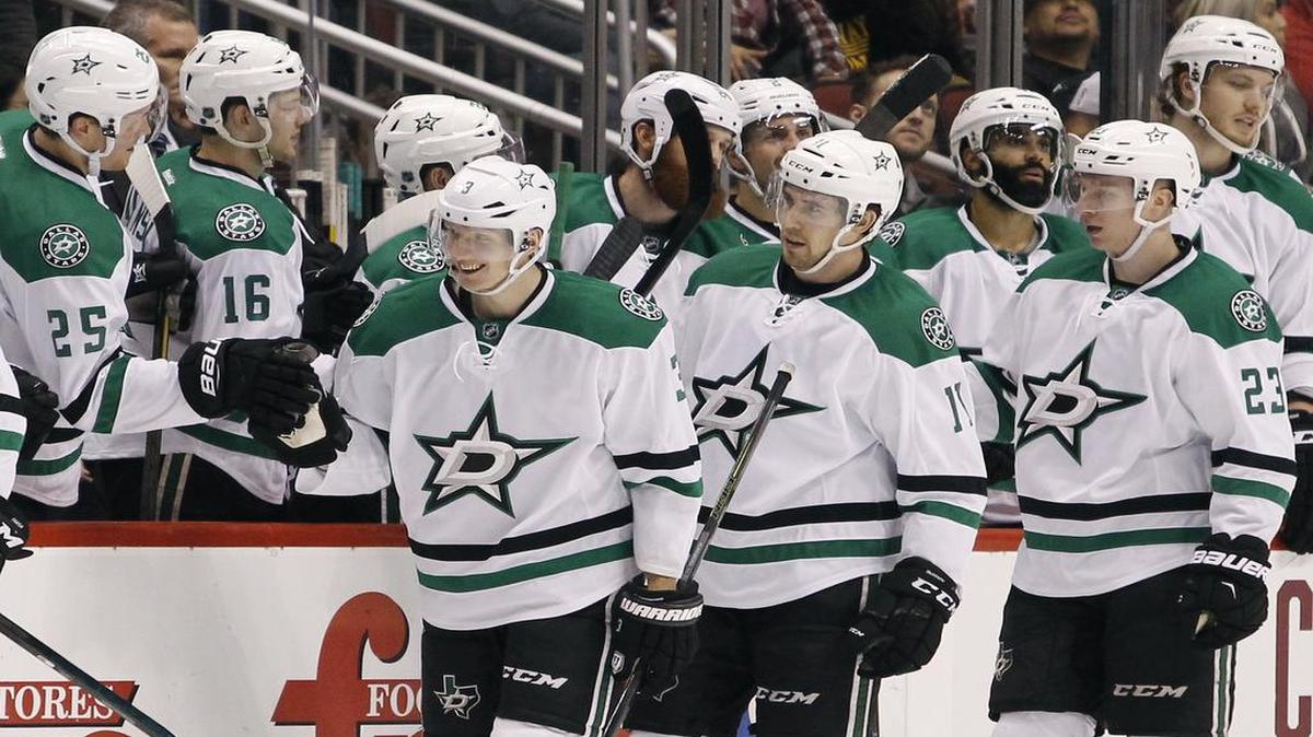 Stars defenseman John Klingberg, front left, is congratulated after his empty net goal against Arizona. It was Klingberg’s third goal of the year and his first in 24 games.