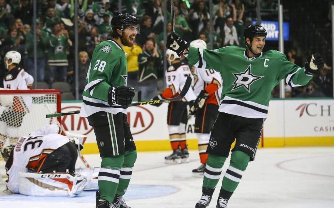 Stephen Johns, left, staked Jamie Benn and the Stars to a 1-0 lead with a goal 3:40 into Thursday’s game. Dallas was outshot 17-1 in the opening period but was tied 1-1 heading to the second.