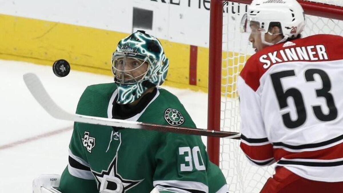 Dallas Stars goalie Ben Bishop eyes the puck before Carolina Hurricanes wing Jeff Skinner scores a third-period goal.
