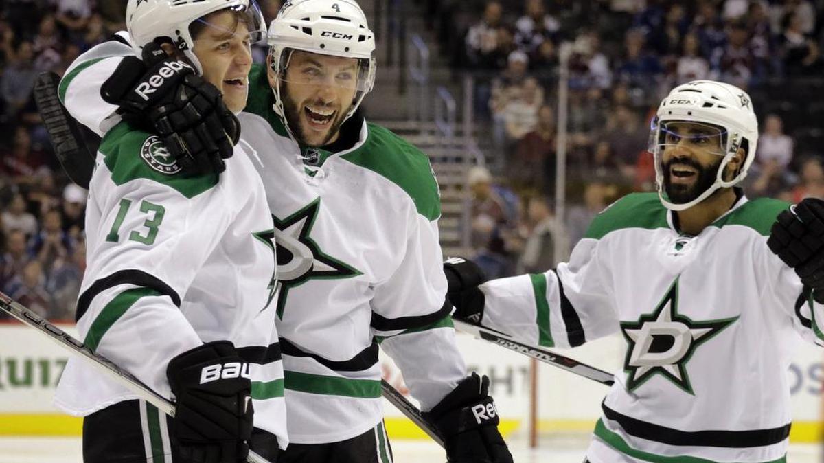 Mattias Janmark, left, celebrates his goal with Dallas Stars teammates Jason Demers, center, and Johnny Oduya.