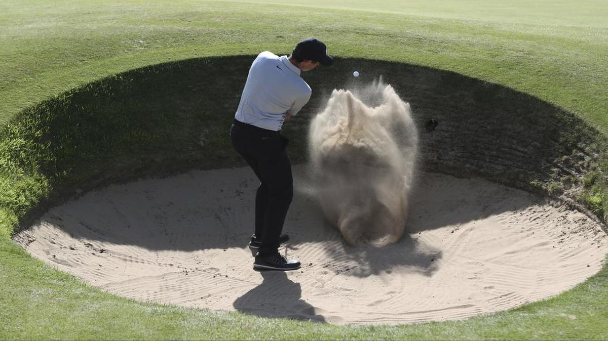 Northern Ireland’s Rory McIlroy plays out of a bunker on the 6th hole during a practice round Tuesday ahead of the British Open Golf Championship, at Royal Birkdale. Television coverage of golf’s third major tournament begins just after midnight Wednesday (actually at 12:30 a.m. Thursday) on the Golf Channel.