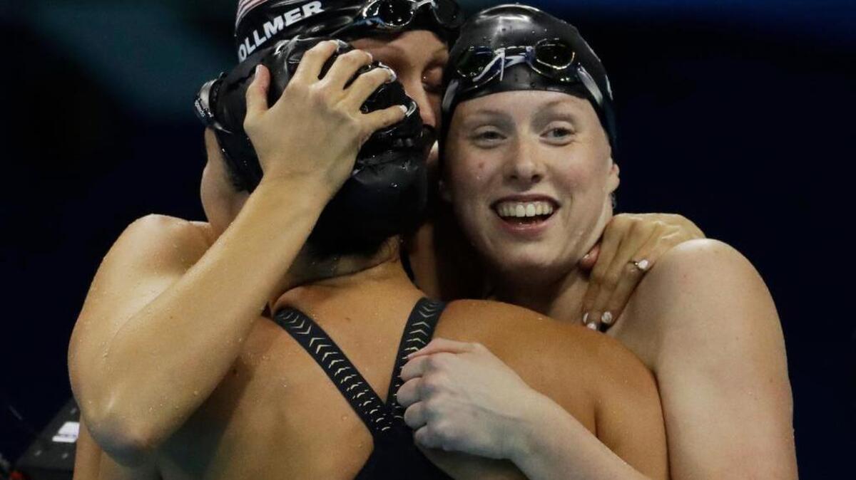 Dana Vollmer, center, celebrates with Kathleen Baker, left, and Lilly King after winning the gold medal.