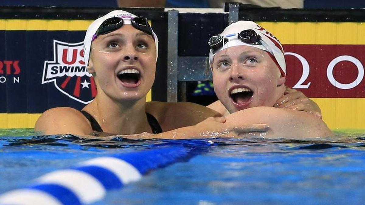 Lilly King, right, and Katie Meili of Colleyville, left, look at the results after King won the women’s 100-meter breaststroke final at the U.S. Olympic swimming trials in Omaha, Neb. Meili finished in second place.