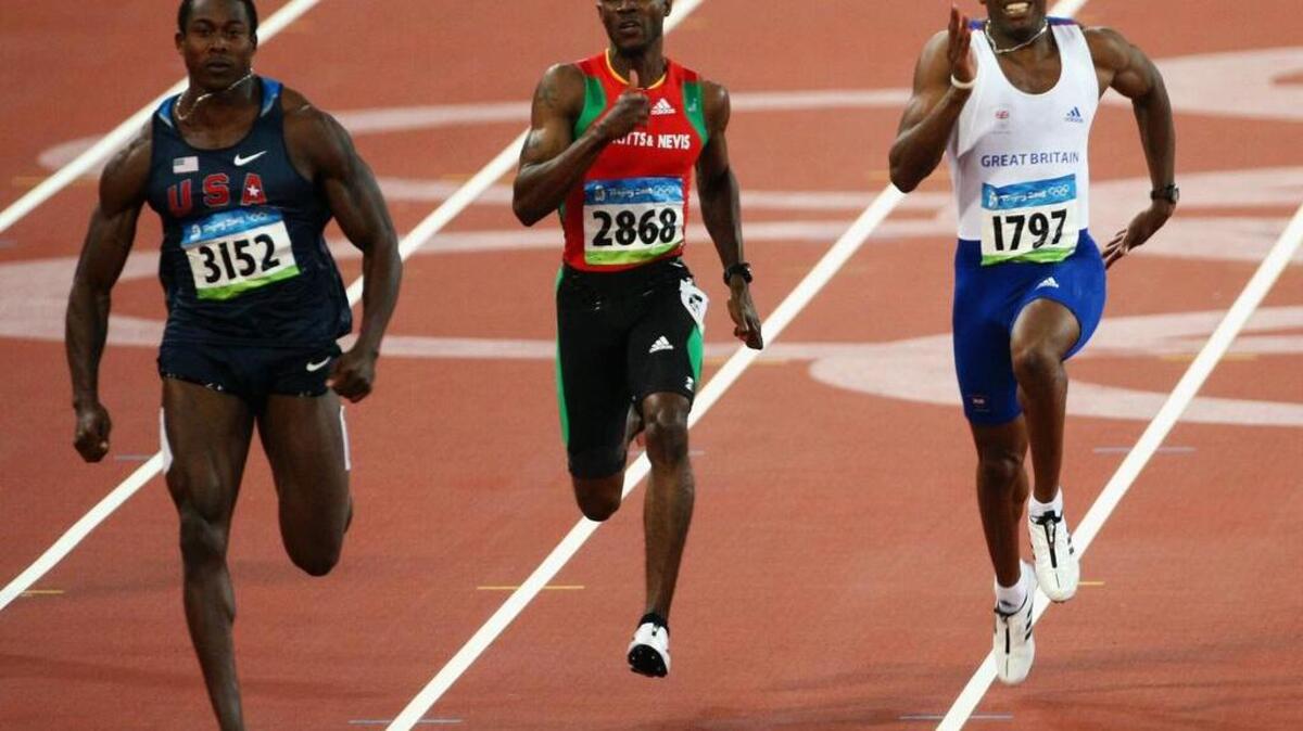 Former TCU sprinter Kim Collins of Saint Kitts and Nevis (middle) has competed in five Olympics.