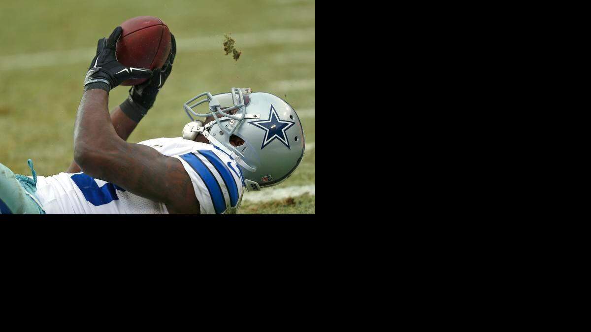 
Dallas Cowboys wide receiver makes what was ruled a catch, then ruled not a catch, during a playoff game against the Green Bay Packers.
