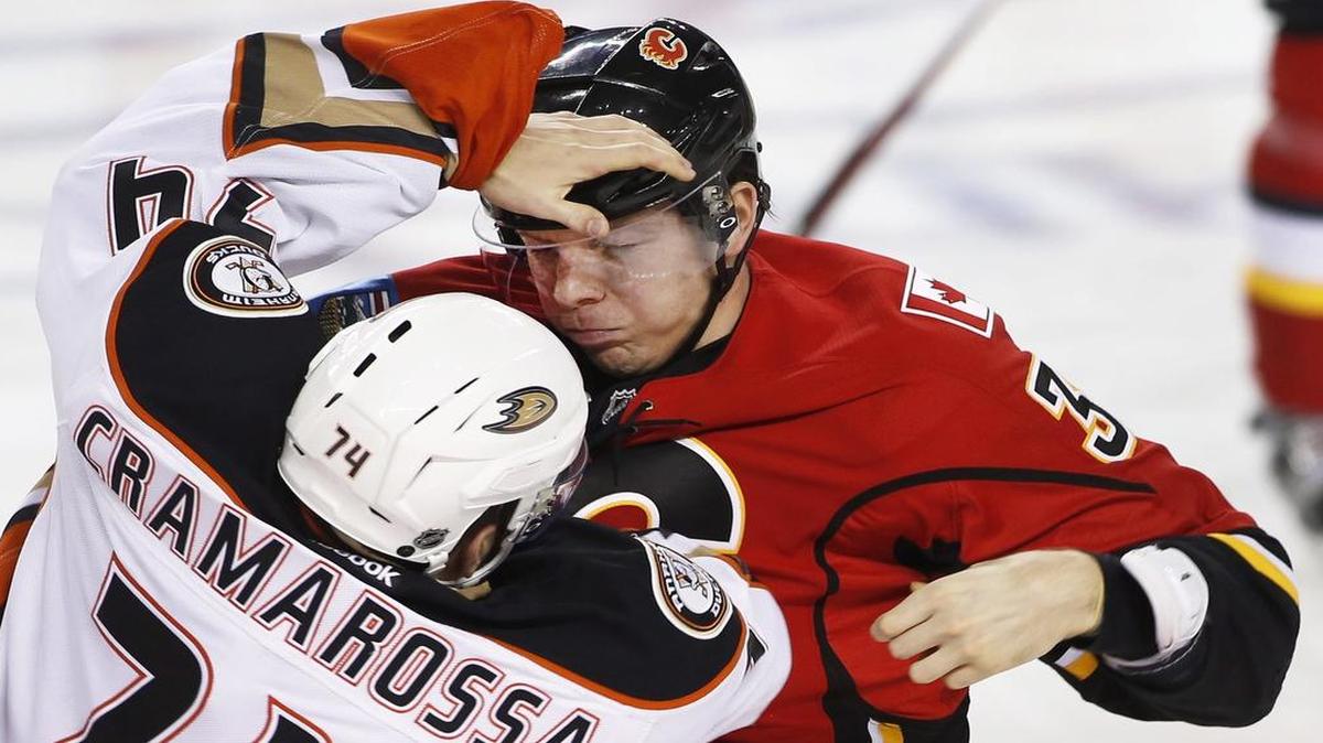 Alex Chiasson, right, of the Calgary Flames mixes it up with the Anaheim Ducks’ Joseph Cramarossa during Sunday’s game. The Flames, who won 8-3, come to Dallas for a matchup against the Stars on Tuesday. The game will be televised at 7:30 p.m. on Fox Sports Southwest.