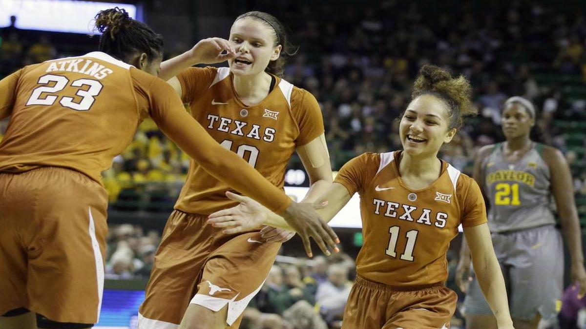 Texas guard Brooke McCarty, right, celebrates Ariel Atkins, left, and Kelsey Lang during the Longhorns’ 85-79 upset of Baylor on Feb. 6 in Waco. With the win, Texas snapped Baylor’s 54-game home winning streak. The rematch is set for Monday night in Austin. Coverage begins at 8 p.m. on ESPN2.