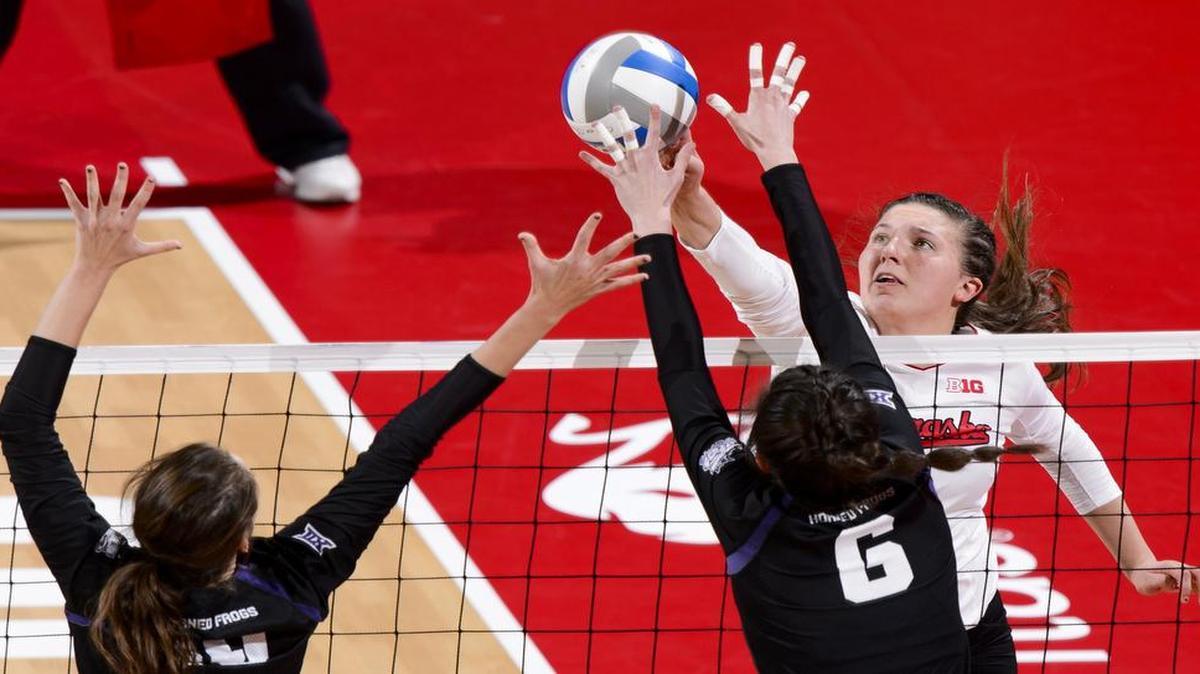 Nebraska outside hitter Mikaela Foecke, tipping the ball over TCU middle blocker Natalie Gower, left, and middle blocker Anna Walsh (6) in an NCAA tournament match Dec. 3, and the Cornhuskers take on Texas on Thursday in an NCAA semifinal match in Columbus, Ohio. The match is scheduled to begin at 8:30 p.m. on ESPN.