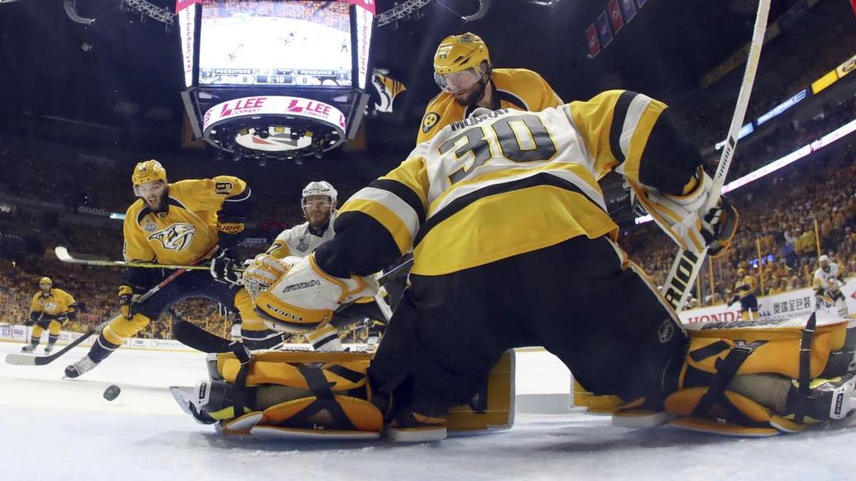 Nashville Predators center Calle Jarnkrok, left, fires the puck past Pittsburgh Penguins goalie Matt Murray on Monday in Game 4 of the Stanley Cup Final. The Predators won 5-1 to even the best-of-seven series at two games apiece. The series shifts back to Pittsburgh for Game 5, which will be televised at 7 p.m. Thursday on NBC (KXAS/Ch. 5).