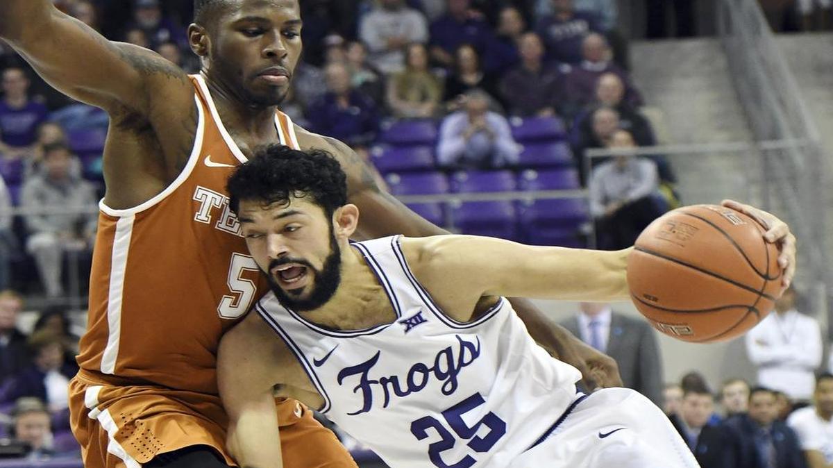 TCU sophomore Alex Robinson, right, drives against Texas’ Kendal Yancy Saturday in the Horned Frogs’ win over the Longhorns. Robinson and the Frogs host the Texas Tech Red Raiders at 8 p.m. Tuesday at Schollamaier Arena. The telecast is on ESPNews.