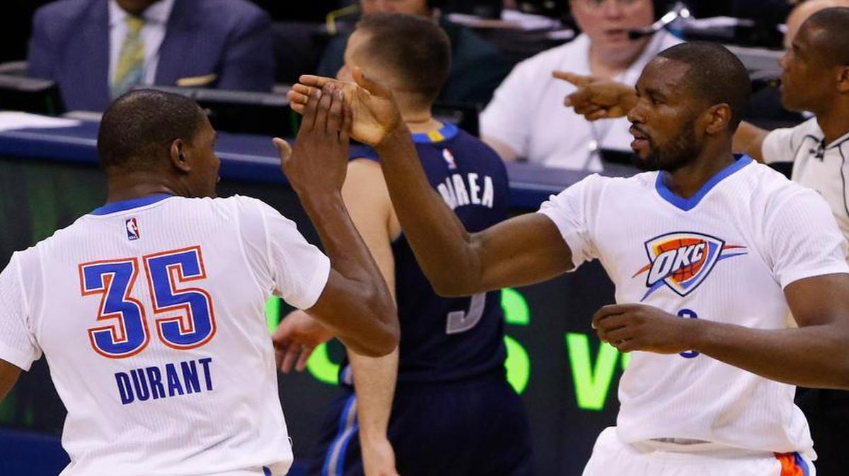 Oklahoma City Thunder forwards Kevin Durant (35) and Serge Ibaka (9) high-five during the first half against the Dallas Mavericks in Game 1. Game 2 is Monday at 7 p.m. at Chesapeake Arena in Oklahoma City. KTXA/21 and TNT have the television coverage.