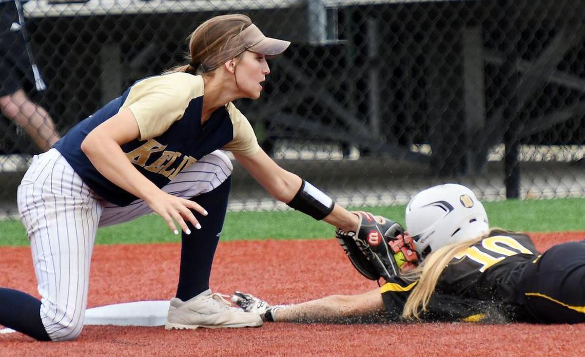 Keller third baseman Riley Love, left, applies the tag on Plano East’s Avery Markley for the out as she tries to slide into the bag in the third inning of Saturday’s May 20, 2017 game three play-off series in Argyle Texas. Keller went on to win 4-3.