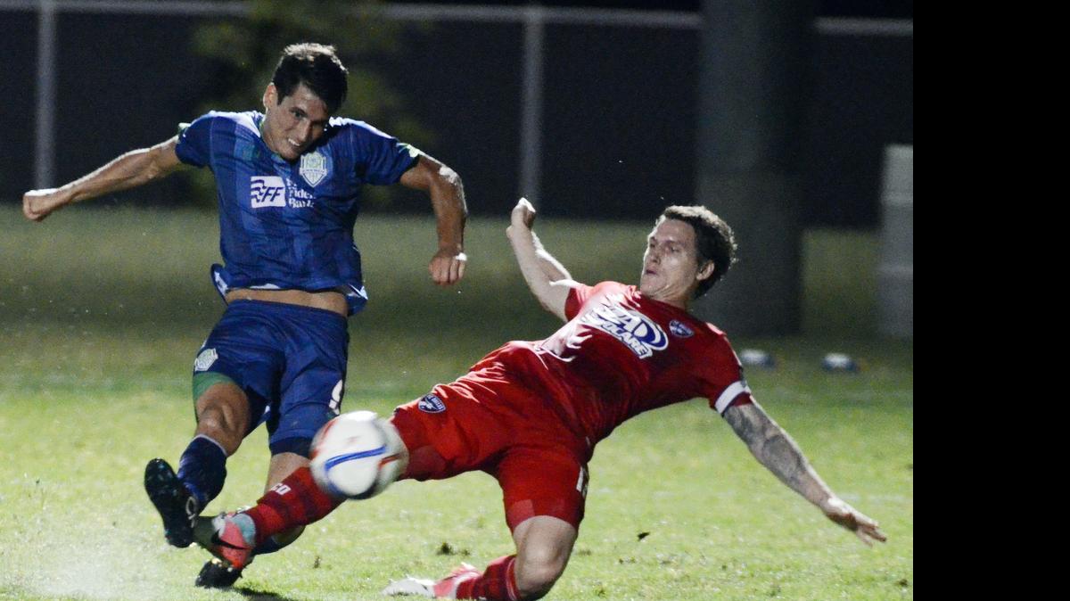 
Oklahoma City FC’s Michael Thomas, left, takes a shot on goal as FC Dallas’ Zach Loyd defends during Tuesday’s U.S. Open Cup match at TCU. FC Dallas won 4-1 to advance to the Round of 16.


