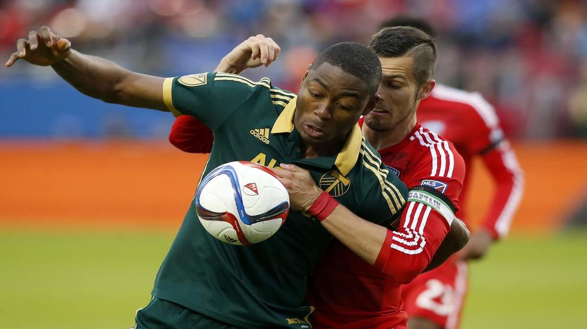 Portland Timbers forward Fanendo Adi, left, battles FC Dallas defender Matt Hedges (24) during the first half of Sunday’s MLS Western Conference finals match in Frisco. Adi scored the opening goal for the Timbers. who advanced to the MLS Cup for the first time.